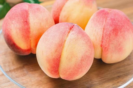Peaches served on a glass plate (wood grain background), JPG Peaches served on a glass plate (wood grain background), JPG