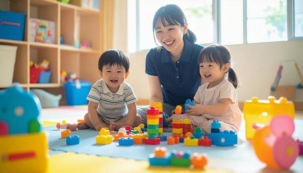 笑顔の保育士と遊ぶ子どもたち 笑顔の保育士と遊ぶ子どもたちの写真