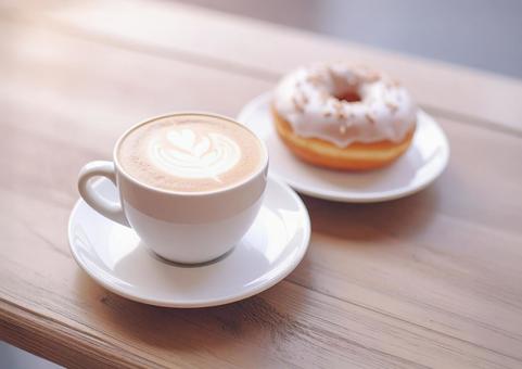 カフェラテとドーナツのあるテーブル01の写真