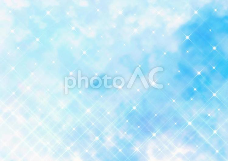 クロスフィルター風の煌めき　幻想的な青空とふわふわの雲（ブルー） クロスフィルター,煌めく,幻想的の写真素材
