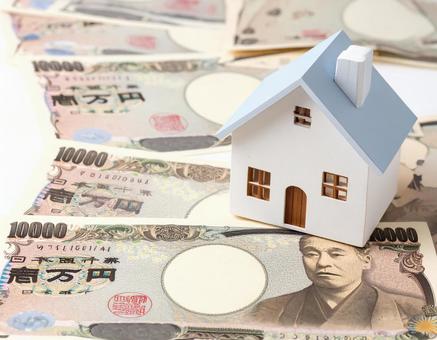 住宅模型とお金の写真 住宅模型とお金の写真の写真