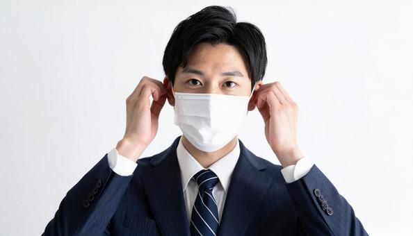 マスクをつける人 マスクをつける人の写真
