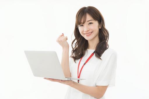 若い女性 ノートパソコン ガッツポーズ 若い女性 ノートパソコン ガッツポーズ 女性,ノートパソコン,ガッツポーズの写真素材