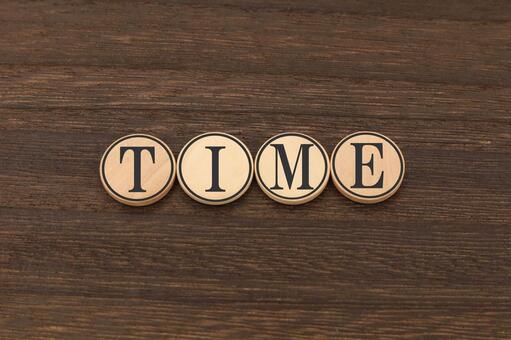 TIMEのウッドチップ文字 time,時間管理,ウッドチップの写真素材