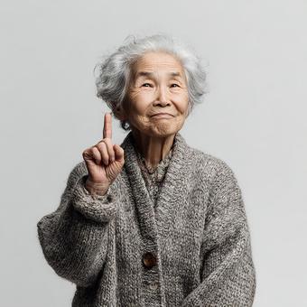 指差しポーズの明るい女性 指差しポーズの明るい女性の写真