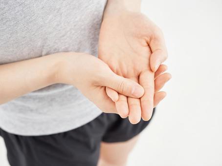 Female holding a sore finger on a white background, dito, polso, mano, JPG