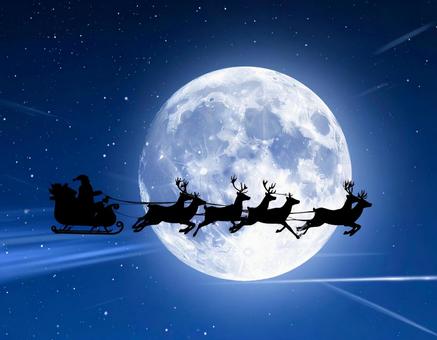 サンタクロースとトナカイと満月の写真素材 サンタクロースとトナカイと満月の写真素材の写真