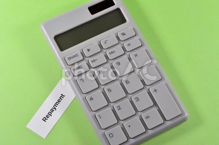 電卓とrepaymentで返済のイメージ repayment,返済,ローンの写真素材