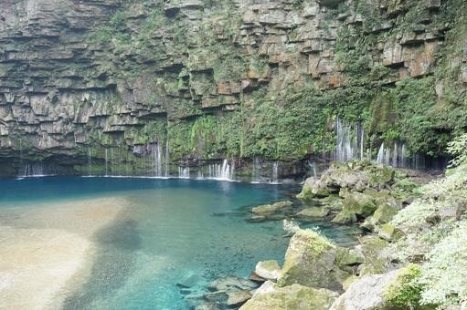 The blue waterfall basin with spring water and rock walls, JPG The blue waterfall basin with spring water and rock walls, JPG