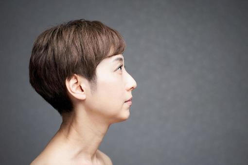 Middle-aged Japanese woman looking sideways, JPG Middle-aged Japanese woman looking sideways, cheek, to hang, mouth, JPG