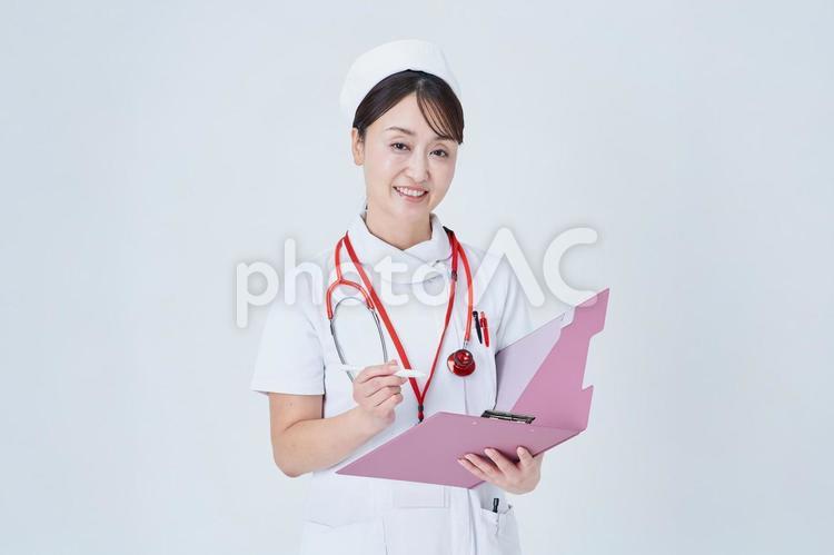 問診する医療スタッフの女性 問診,カルテ,質問の写真素材