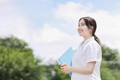 Female nurse standing with a smile on a blue sky background, nurse, nurse, female, JPG