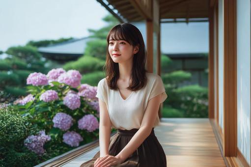 アジサイと古民家と女性 アジサイと古民家と女性の写真