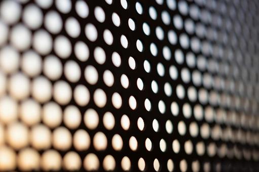 奥行きのある金属の穴 背景,パンチングメタル,金属の写真素材