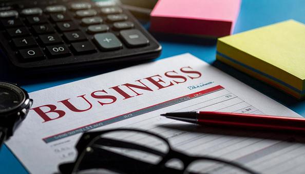 BUSINESSと赤字で書かれた画用紙の写真