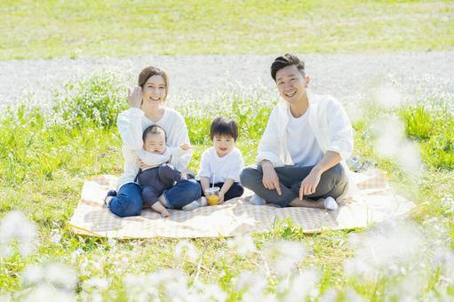 Parents and children enjoying a picnic Parents and children enjoying a picnic