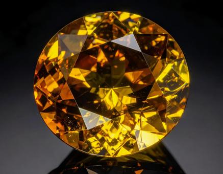 シトリン　ラウンドカット　黒背景の写真