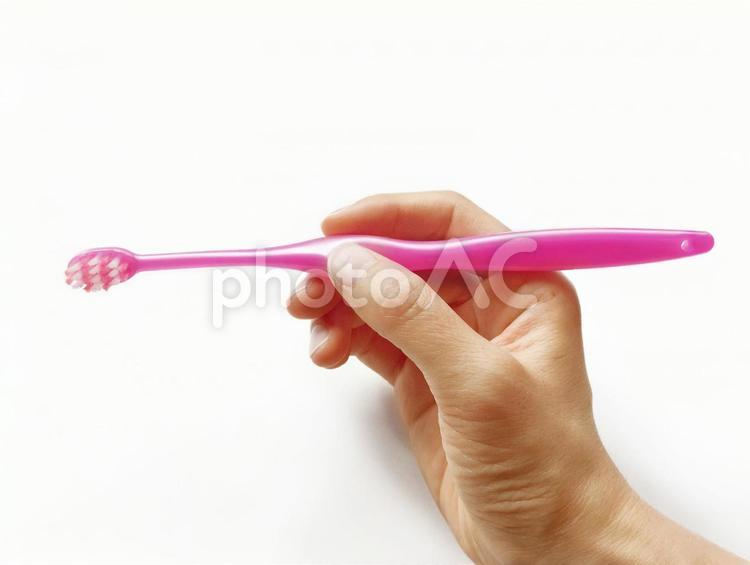 歯ブラシの持ち方「ペングリップ」 歯ブラシ,歯磨き,ペングリップの写真素材