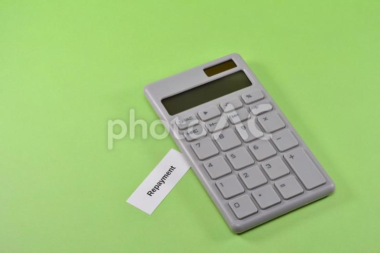 電卓とrepaymentで返済のイメージ repayment,返済,ローンの写真素材
