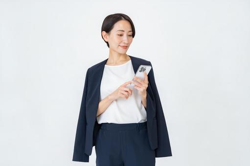 携帯を持つ女性 ビジネス,オフィス,ビジネスウーマンの写真素材