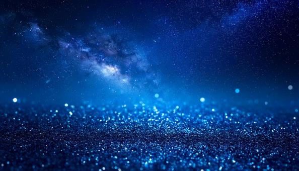 キラキラ輝く青い星空の背景の写真