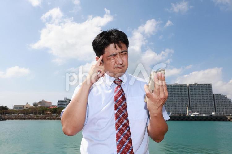 困惑した表情の男性 日本人,男性,男の写真素材