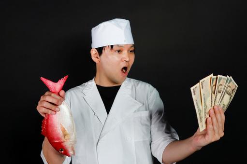 魚とお金を持つ寿司職人 魚とお金を持つ寿司職人 寿司職人,魚,お金の写真素材