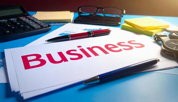 BUSINESSと赤字で書かれた画用紙 BUSINESSと赤字で書かれた画用紙の写真
