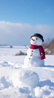 雪原の中の雪だるま 冬イメージ 雪原の中の雪だるま 冬イメージの写真