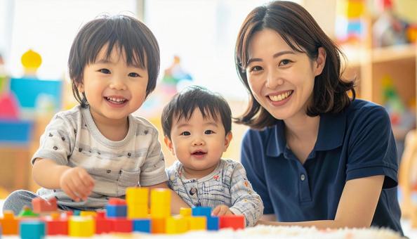 笑顔の保育士と遊ぶ子どもたち 笑顔の保育士と遊ぶ子どもたちの写真