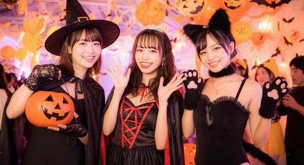 ハロウィンパーティーを楽しむ3人の女性の写真