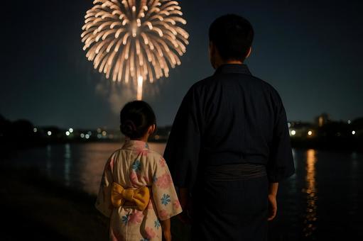 花火大会を見上げる浴衣姿の日本人親子 花火大会を見上げる浴衣姿の日本人親子の写真
