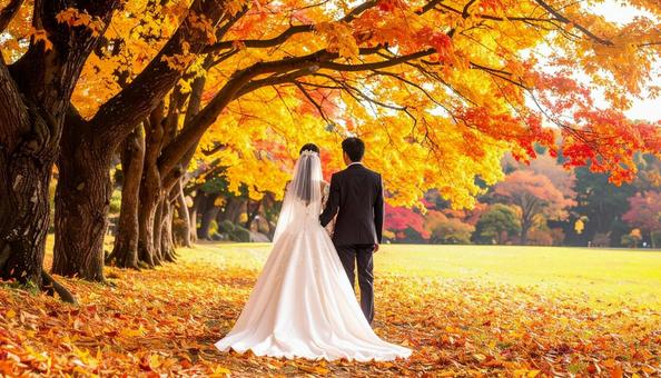 紅葉のウェデイングドレス姿の花嫁と花婿 紅葉のウェデイングドレス姿の花嫁と花婿の写真
