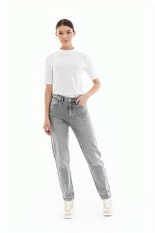Woman in T-shirt with one hand in pocket, JPG
