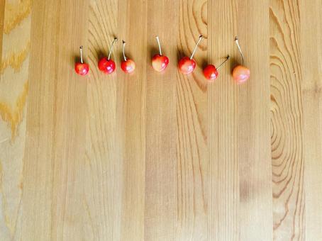 さくらんぼ　チェリー　果物　赤い実　果実　かわいい　おしゃれ　木目　甘い さくらんぼ,チェリー,果物の写真素材