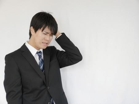 20's man businessman hold head 20's man businessman hold head