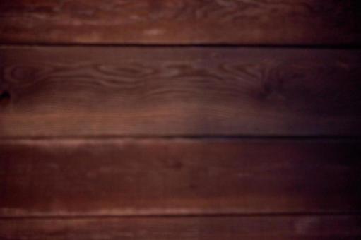 ピントの合わない暗い茶色ブラウン木目背景 壁,板,木目の写真素材