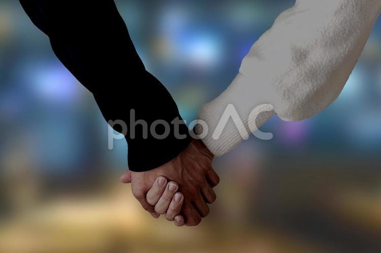男女が手を繋ぐシルエット 手,カップル,パートナーの写真素材