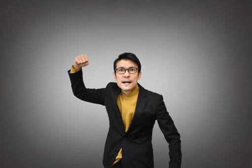 こぶしを振り上げる男性 揉め事,いがみ合う,対立の写真素材