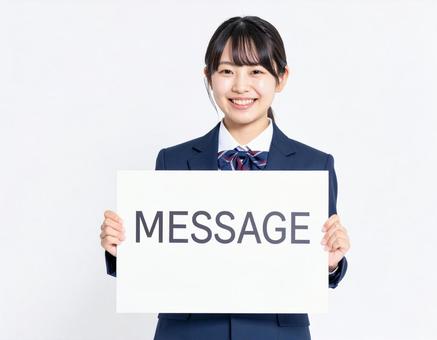 「メッセージ」と書いたボードをもつ若者 「メッセージ」と書いたボードをもつ若者の写真