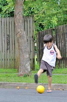 Kid kicking the ball Kid kicking the ball