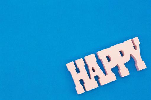 HAPPY（ハッピー）木製文字と青い余白 ハッピー,文字,英語の写真素材