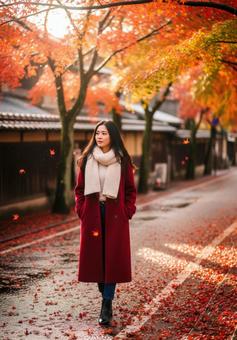 秋の旅行先で散策を楽しむおしゃれな女性 秋の旅行先で散策を楽しむおしゃれな女性の写真