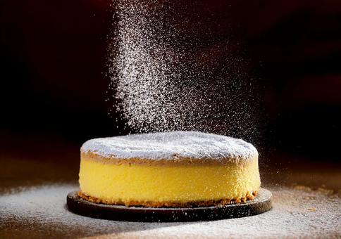 温もり背景に舞うスフレケーキの写真