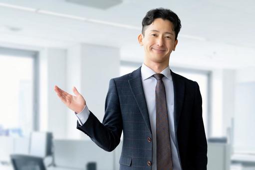 笑顔で案内する男性ビジネスマン 男性,ビジネス,人物の写真素材