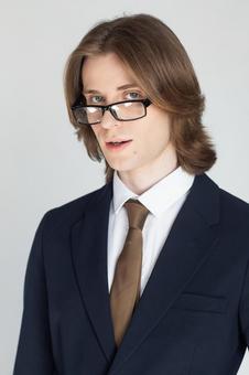 メガネをずらしたスーツの男性 男性,外国人,欧米人の写真素材