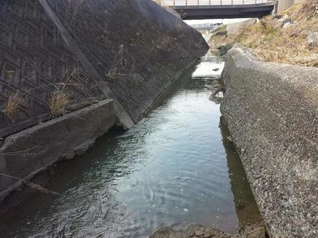 Narrow river with concrete banks, JPG