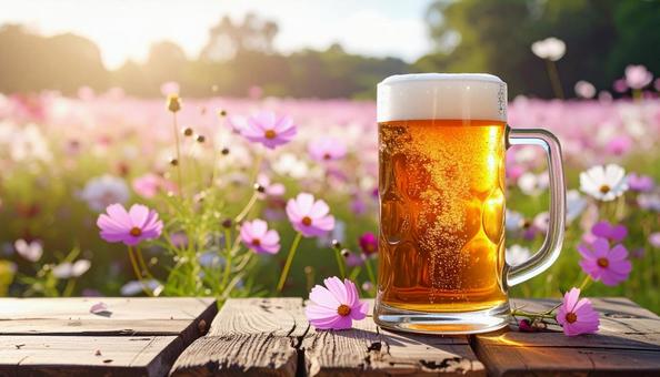 生ビールとコスモスの写真