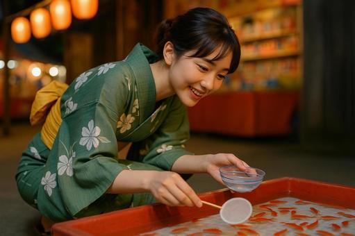 浴衣女性金魚すくい横構図 浴衣女性金魚すくい横構図の写真