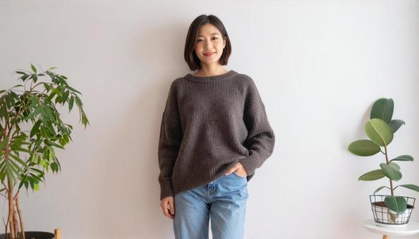 茶色のセーターを着た女性 茶色のセーターを着た女性の写真